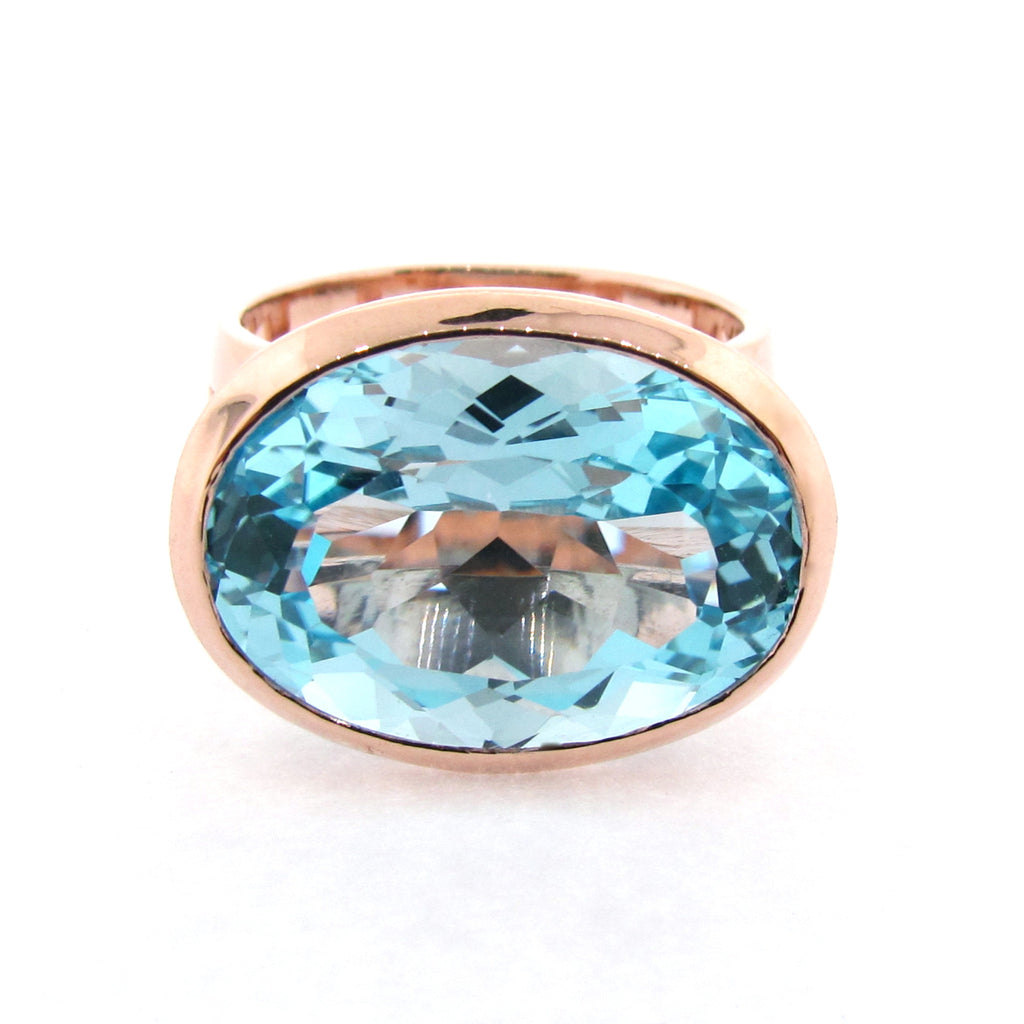 Rose Gold Blue Topaz Horizon Ring